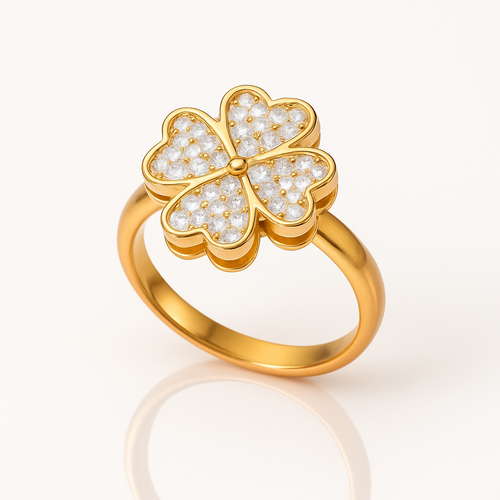 Gold ring with a floral design on a white background